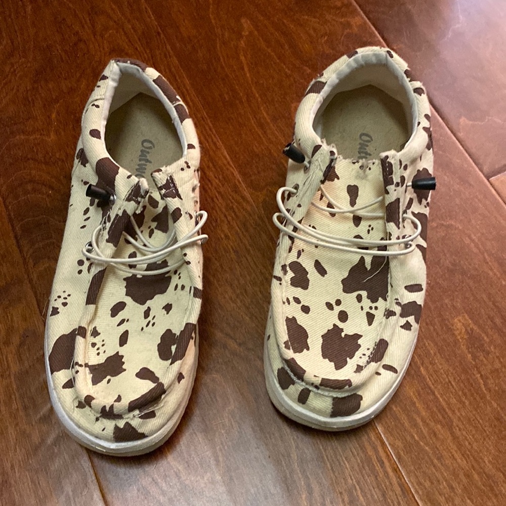 Women’s size 7.5 outlook slip on shoes. Cow print.